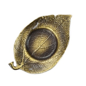 a bronze leaf teacup