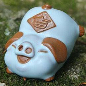a road-patterned pig doll